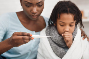 Mother caring for sick daughter